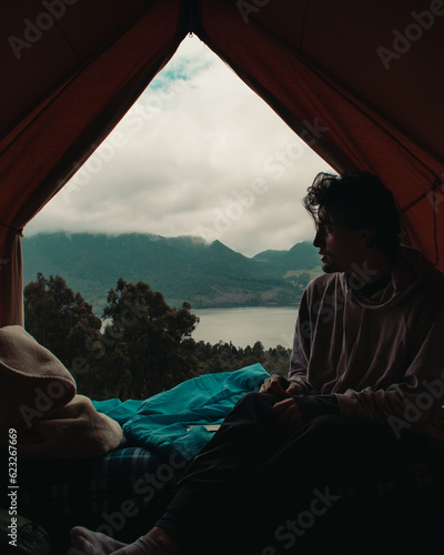 guy camping on the mountain