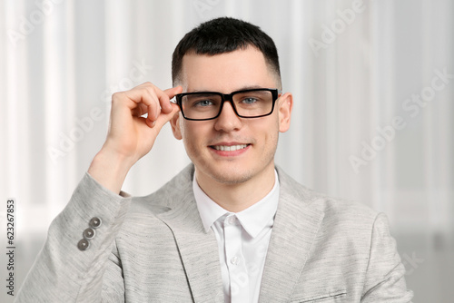 Young man having online video call indoors, view from web camera