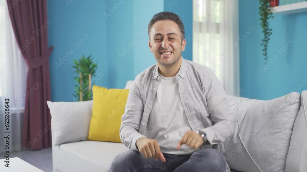 The man making cute gestures for the camera. The man making cute gestures for the camera.