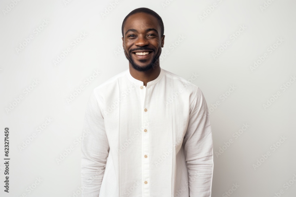 Portrait of smiling african american man standing against white background Portrait of smiling african american man standing against white background