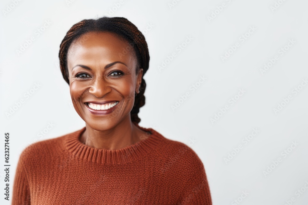 Portrait of a smiling african american woman standing against white background Portrait of a smiling african american woman standing against white background