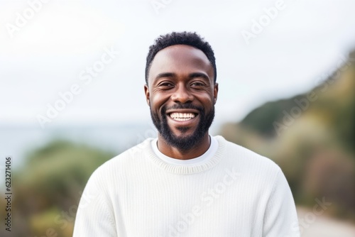 Portrait of a handsome african american man smiling outdoors.