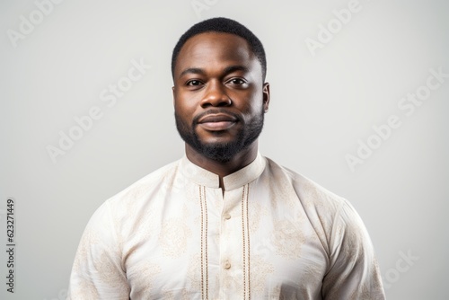 Portrait of a handsome african man in traditional clothes looking at camera