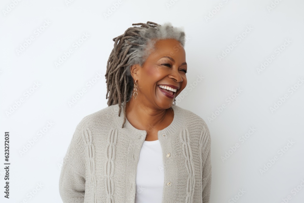 Portrait of a happy african american woman smiling against white background Portrait of a happy african american woman smiling against white background