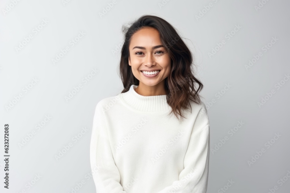 Portrait of a smiling young woman looking at camera isolated on a white background Portrait of a smiling young woman looking at camera isolated on a white background