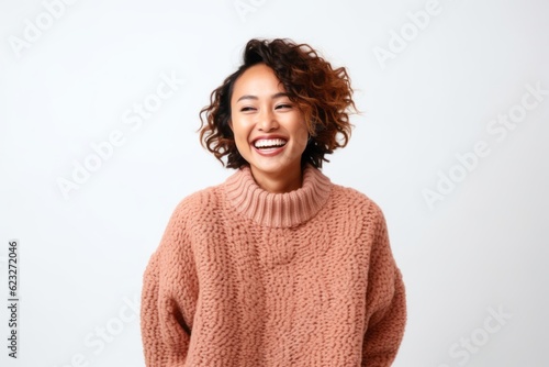 Portrait of a happy african american woman smiling and looking at camera over white background