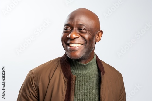 Portrait of a happy african american man smiling against white background