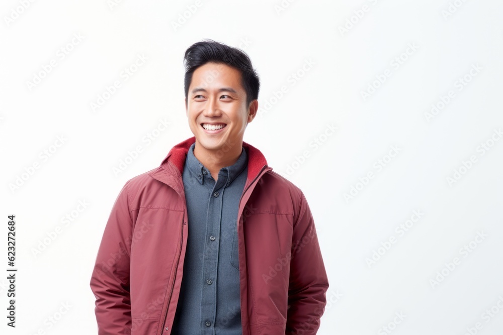 Young Asian man smiling and looking at camera. Isolated on white background. Young Asian man smiling and looking at camera. Isolated on white background.