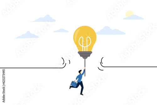Concept of overcoming obstacles to achieve target goals. Overcoming limits. Challenge ideas and abilities. Break through the limits of freedom. Businessman businessman flying with light bulb idea.