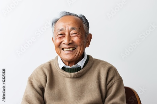 Portrait of a happy senior asian man smiling and looking at camera