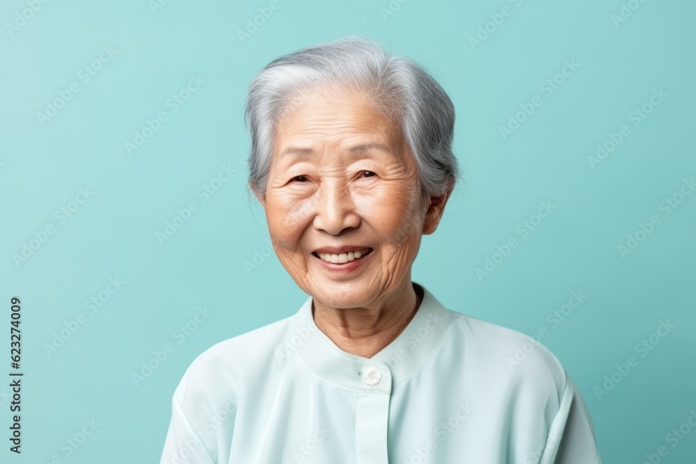 Medium shot portrait photography of a satisfied 100-year-old elderly chinese woman wearing a simple tunic against a pastel or soft colors background Medium shot portrait photography of a satisfied 100-year-old elderly chinese woman wearing a simple tunic against a pastel or soft colors background
