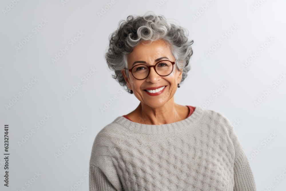 Portrait of happy senior woman in eyeglasses looking at camera isolated over white background Portrait of happy senior woman in eyeglasses looking at camera isolated over white background