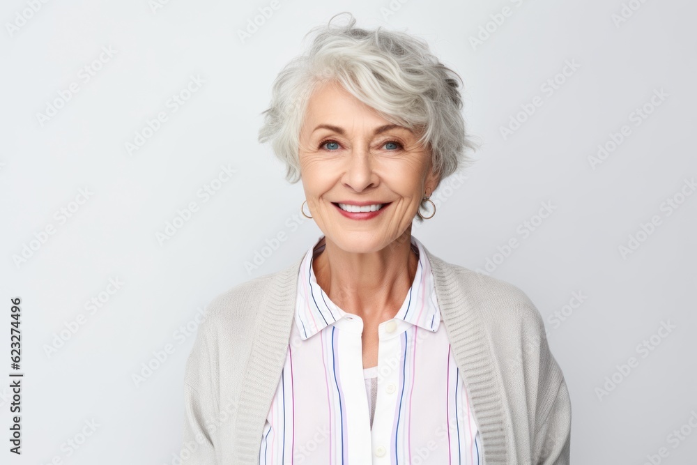 smiling senior woman with grey hair looking at camera isolated on grey smiling senior woman with grey hair looking at camera isolated on grey