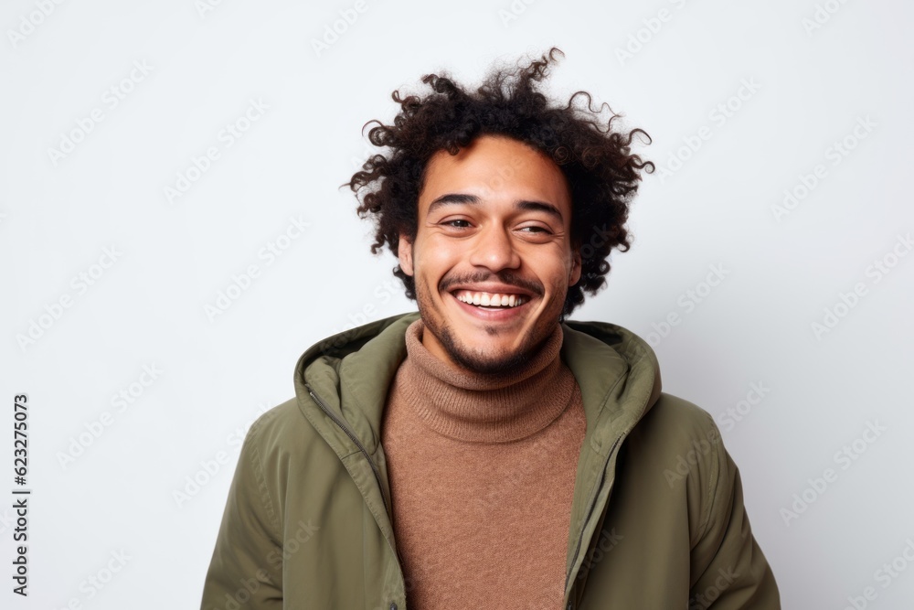 Portrait of a happy young african american man smiling over white background Portrait of a happy young african american man smiling over white background