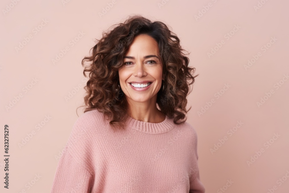 Portrait of a beautiful woman with curly hair smiling at the camera Portrait of a beautiful woman with curly hair smiling at the camera