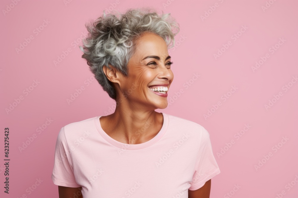 Cheerful african american woman smiling and looking away isolated over pink background Cheerful african american woman smiling and looking away isolated over pink background