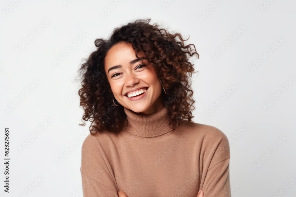 Portrait of a happy young woman smiling and looking at camera isolated on a white background Portrait of a happy young woman smiling and looking at camera isolated on a white background