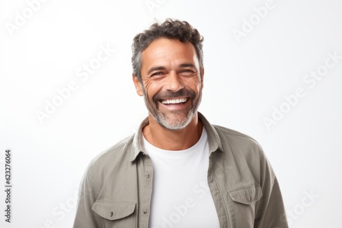 Portrait of a happy mature man smiling at camera over white background