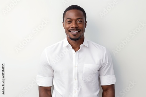 portrait of smiling african american man in white t-shirt