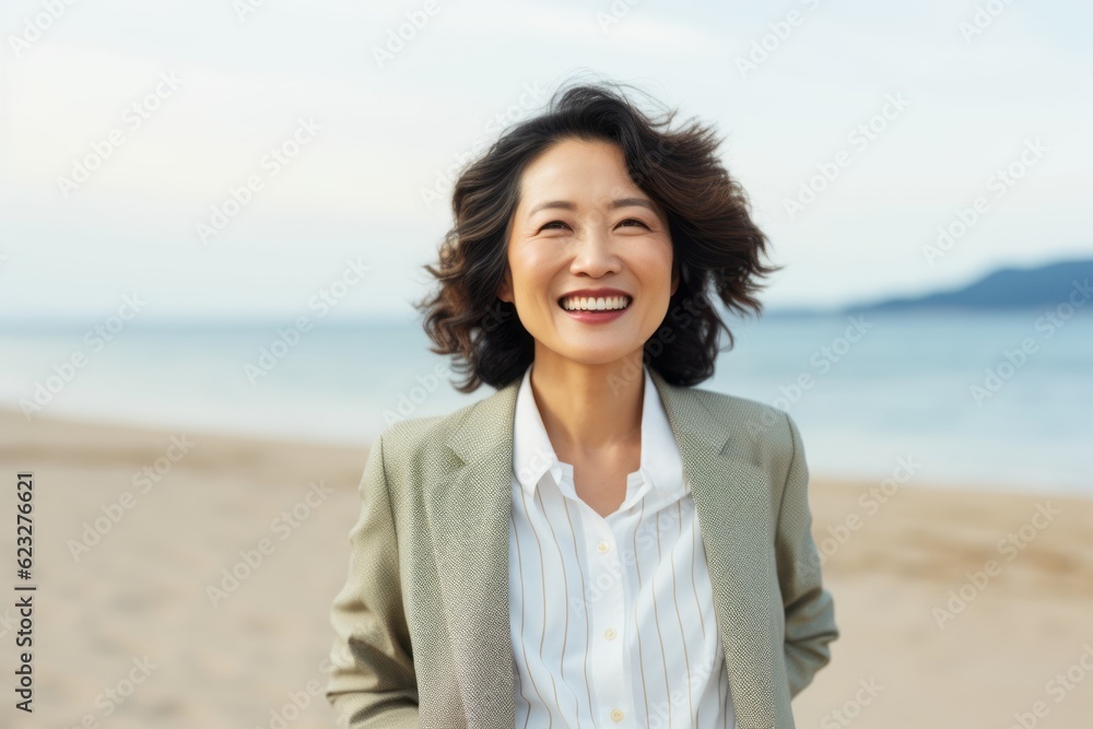 portrait of happy asian businesswoman on the beach in summer portrait of happy asian businesswoman on the beach in summer
