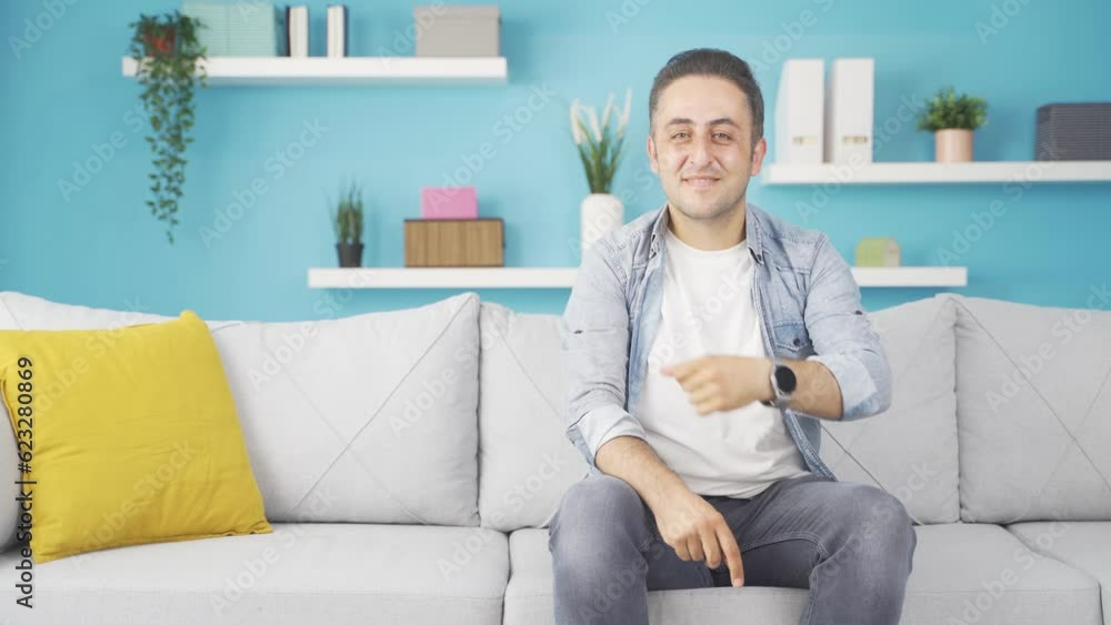 The man promoting is pointing to the side and laughing. The man promoting is pointing to the side and laughing.