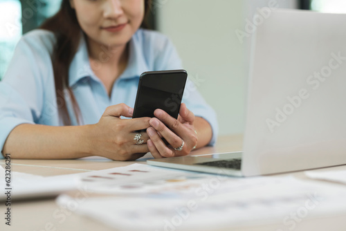 Businesswoman Engaging with Mobile Phone Technology. Digital Entrepreneurship.