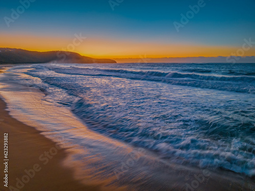 Sunrise and waves at the seaside