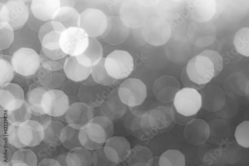 Abstract gray background with blurred bokeh light. Beautiful gray black white bokeh out of focus background