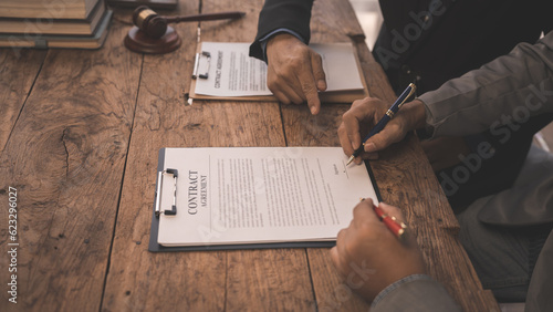 Full concentration at work. correctly sign contracts with clients, Sign and Execute Binding Contracts, contracts jargon, legal terms and definitions, signed by unauthorised person