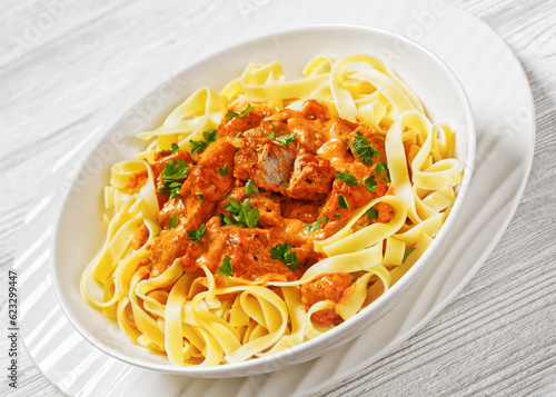 Creamy Paprika Pork Chunks over tagliatelle noodle