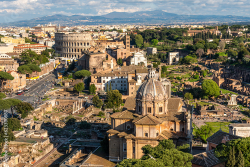Aerial view of the Roman Forum, including the Curia Julia and the Colosseum, as seen from the top of the vitt photo