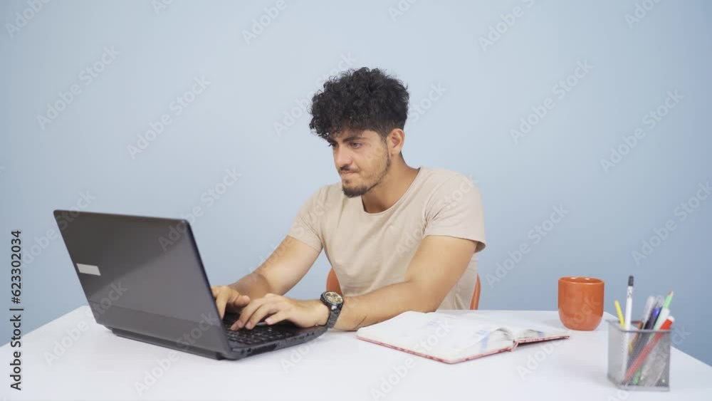 Man closing laptop with angry expression. Man closing laptop with angry expression.