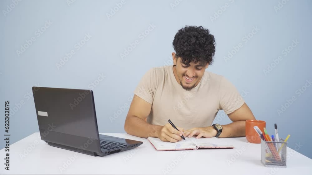 Man looking at laptop making positive gesture. Man looking at laptop making positive gesture.