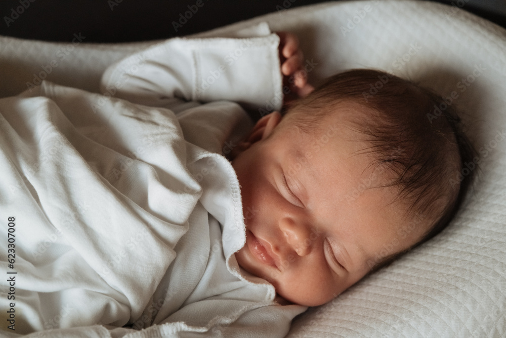 Beautiful caucasian newborn baby Child sleeping in bed. Little kids concept. Close-up portrait Beautiful caucasian newborn baby Child sleeping in bed. Little kids concept. Close-up portrait