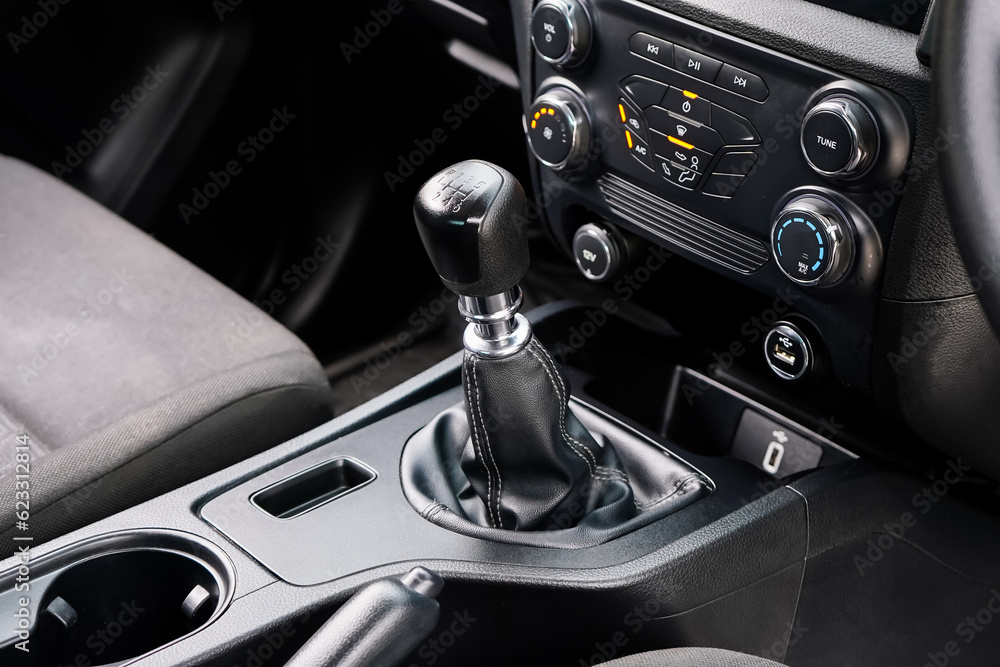 automatic transmission shift selector in the car interior. Closeup a manual shift of modern car gear shifter. 4x4 gear shift