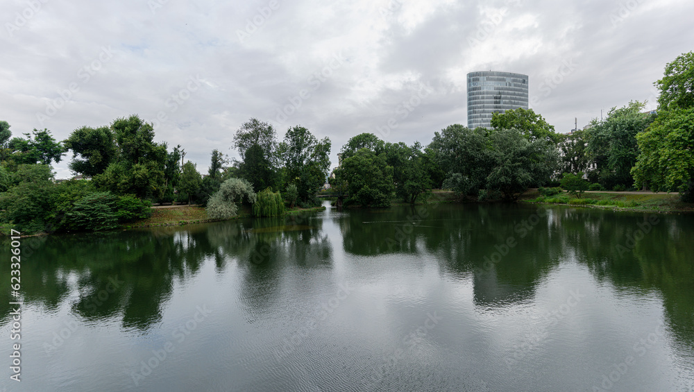 Reflections of trees and cloudy sky in a lake Reflections of trees and cloudy sky in a lake