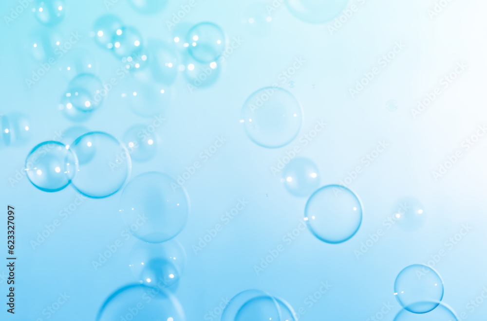 Beautiful Transparent Blue Soap Bubbles Floating in The Air. Abstract Blurred Background. Celebration Festive Backdrop.  Soap Suds Bubbles Water	
