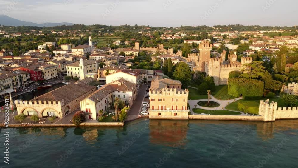 Drone shot of a crowded market at the boulevard on Lake Garda at sunset Drone shot of a crowded market at the boulevard on Lake Garda at sunset