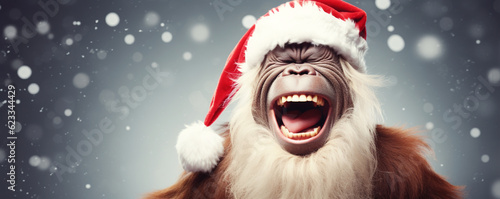 Happy orangutan in a Christmas hat ready for holiday celebrations - Generative Ai © FATHOM
