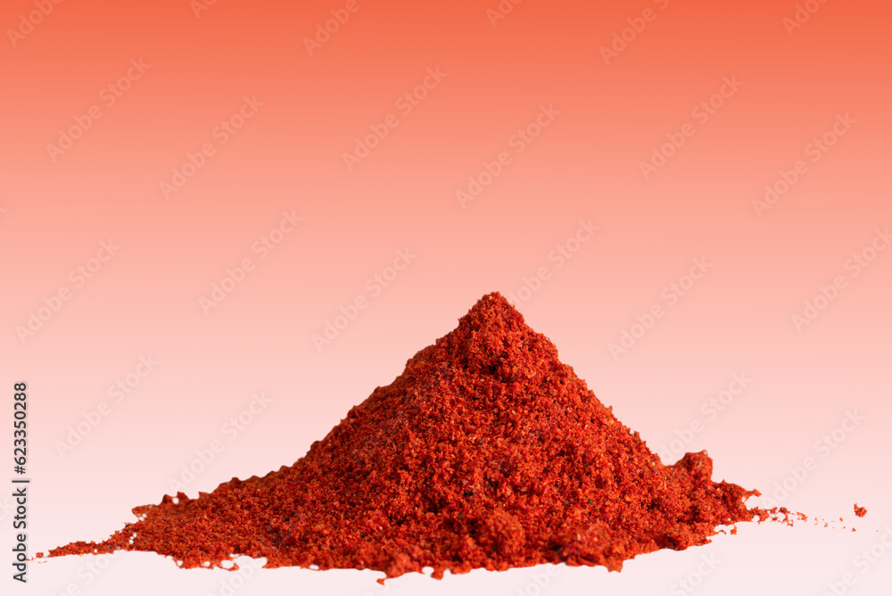 Heap of ground paprika on red background, copy space. Heap of ground paprika on red background, copy space.