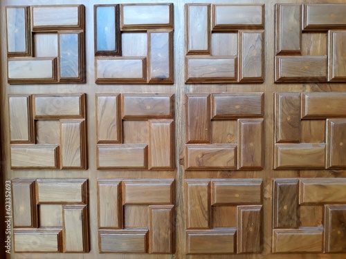 Wooden craft door with embossed block pattern as background template. wood fiber