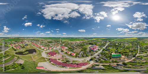 Fototapeta Naklejka Na Ścianę i Meble -  aerial full seamless spherical hdri 360 panorama from great height on red roofs of center of small city or countyside  in equirectangular projection. May use like skydome replacement for drone shots