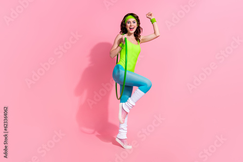 Photo of excited coach lady celebrate national gymnastics competition win raise hands up isolated on pastel color background © deagreez