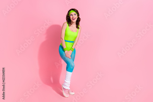 Photo of sporty lady in retro nostalgia sport outfit look empty space sale offer isolated over pastel color background