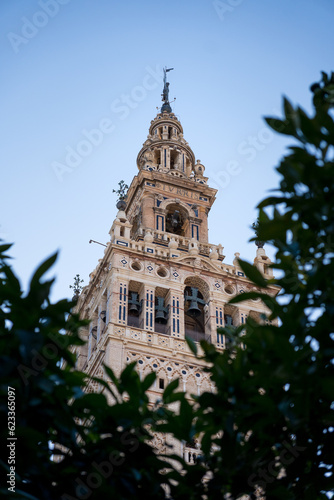 Belfry of the Giralda in Seville (Andalusia, Spain). Minaret of Seville Cathedral. The most famous religious tower in the city of Seville.