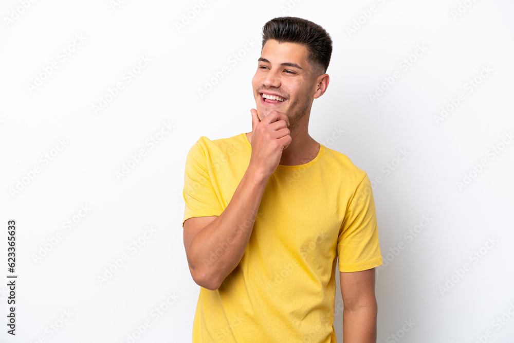Young caucasian man isolated on white background looking to the side and smiling Young caucasian man isolated on white background looking to the side and smiling