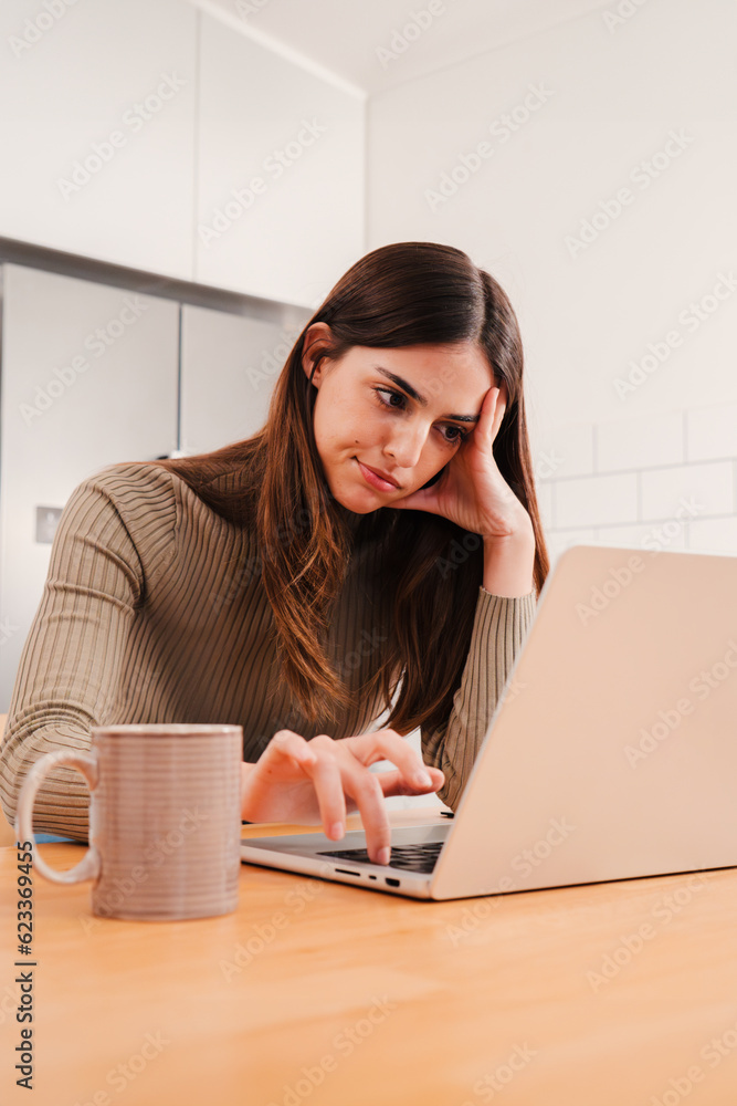Vertical portrait of woman overworked exhausted of use a laptop, having stress headache. Burnout frustrated freelance female with anxiety problems sitting at home. Sad and unhappy student girl tired Vertical portrait of woman overworked exhausted of use a laptop, having stress headache. Burnout frustrated freelance female with anxiety problems sitting at home. Sad and unhappy student girl tired