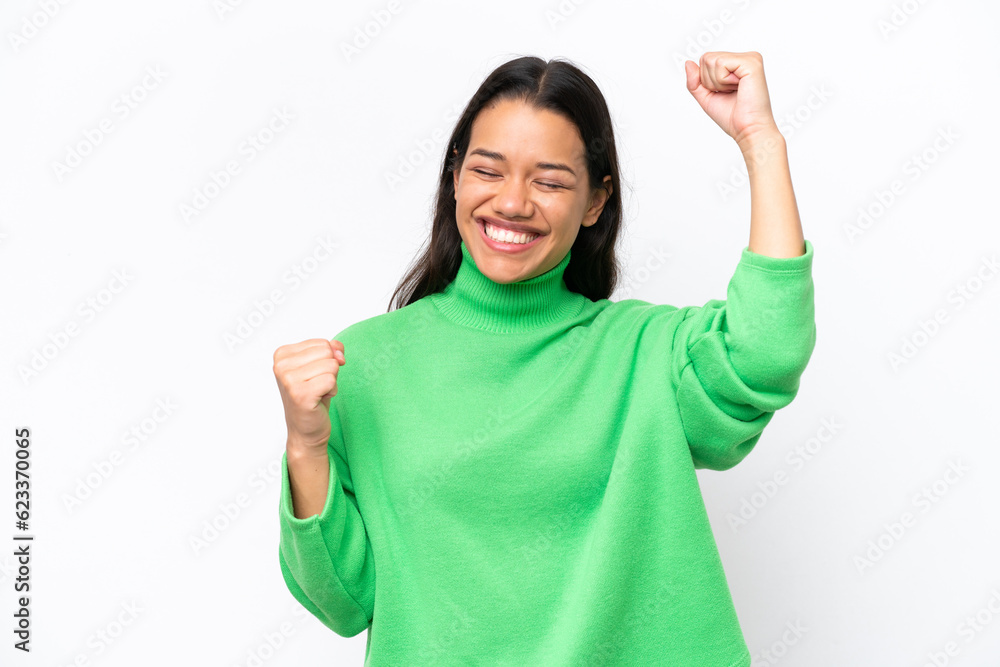 Young Colombian woman isolated on white background celebrating a victory Young Colombian woman isolated on white background celebrating a victory