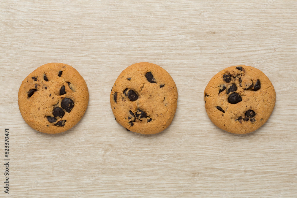 Flat lay with chocolate chip cookies on wooden background Flat lay with chocolate chip cookies on wooden background