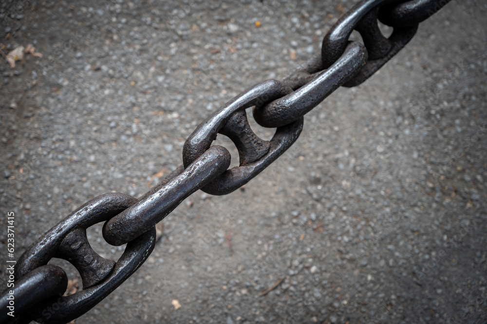 Detail closeup texture of a very thick metallic chain Detail closeup texture of a very thick metallic chain